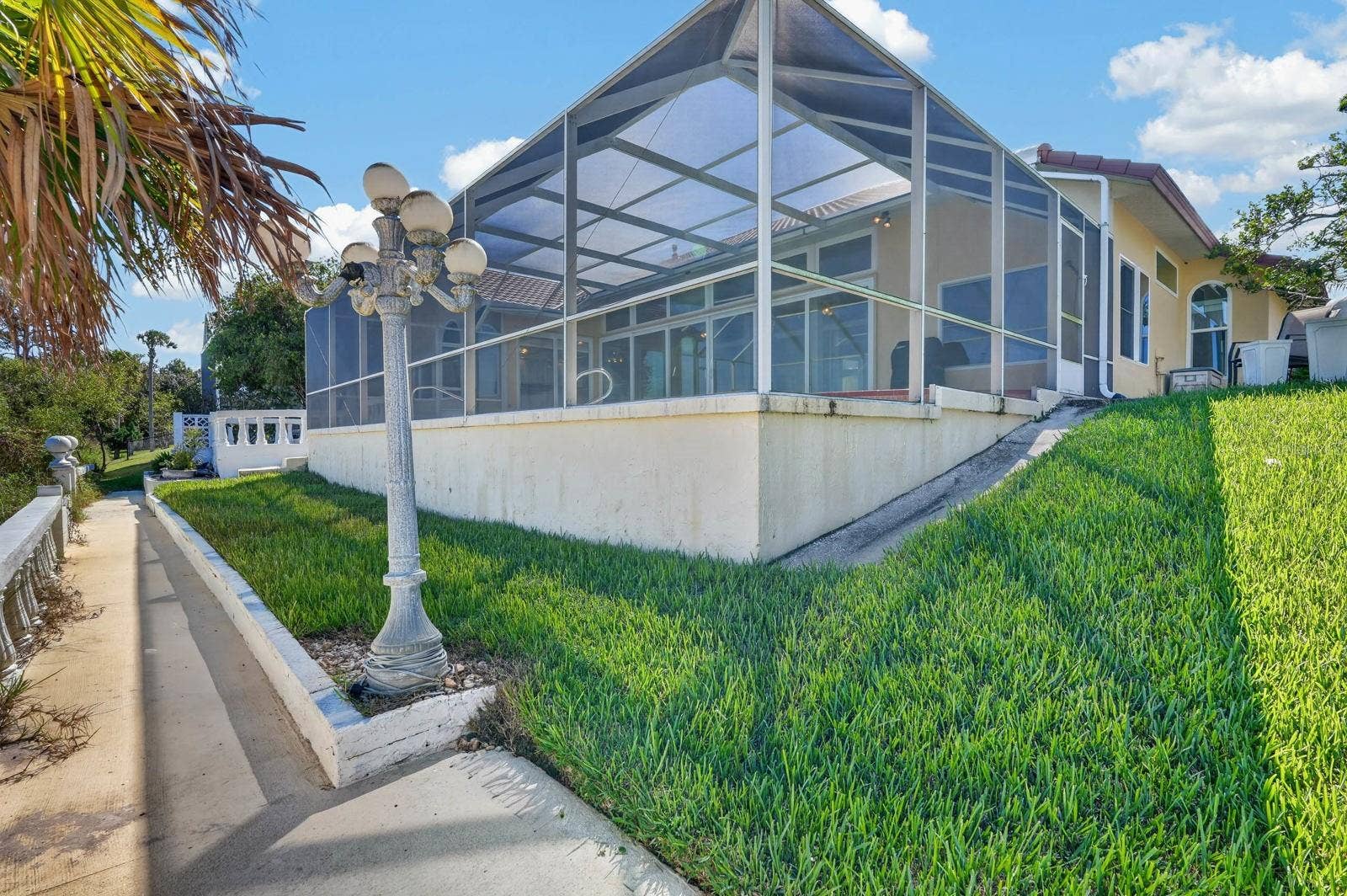 74 COVINGTON LANE, Palm Coast, FL 32137 Exterior Terrace and Pool Enclosure