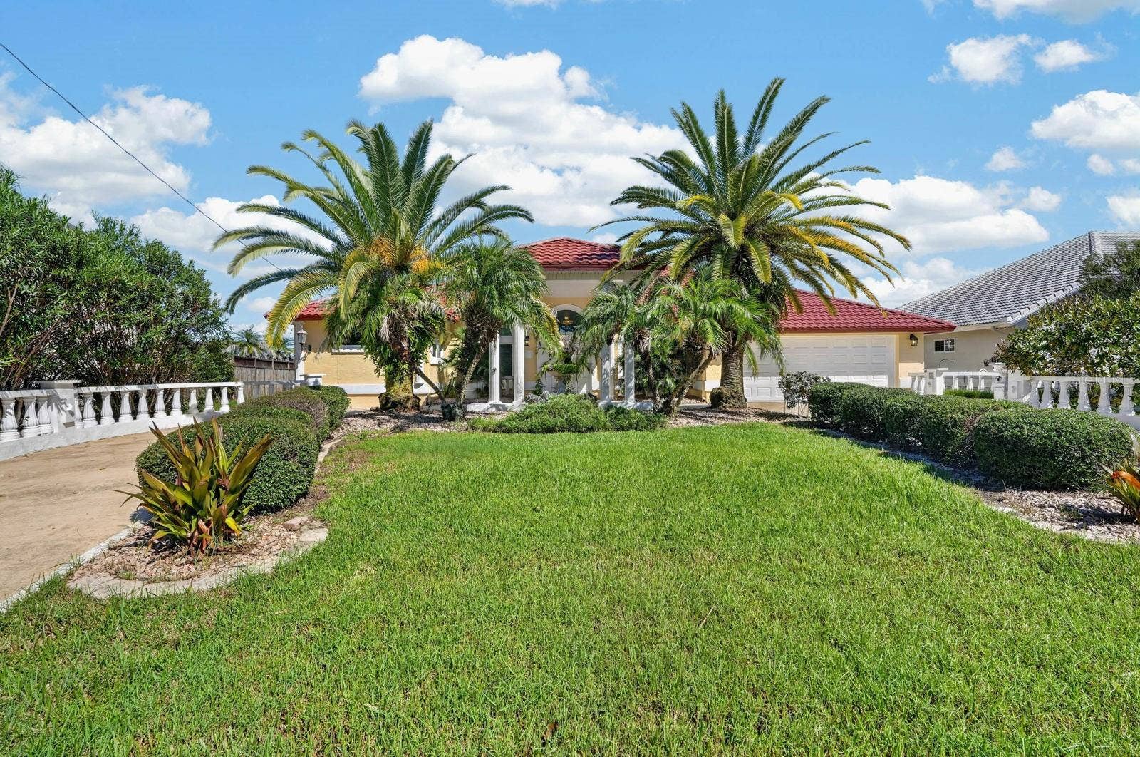 74 COVINGTON LANE, Palm Coast, FL 32137 Welcoming Entrance with Tropical Landscaping