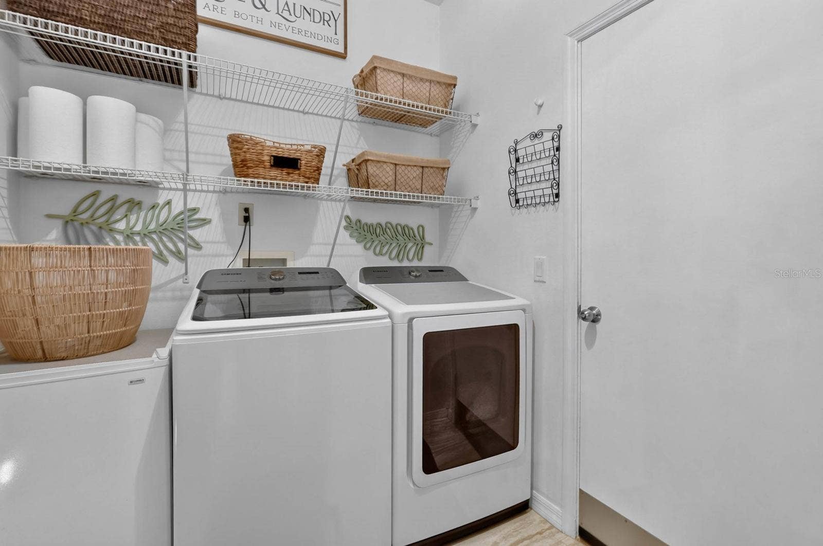 70 PICKERING DRIVE, Palm Coast, FL 32164 In home laundry room with shelving