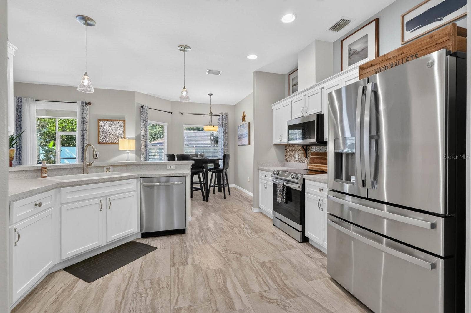 70 PICKERING DRIVE, Palm Coast, FL 32164 Open kitchen with new stainless steel appliances
