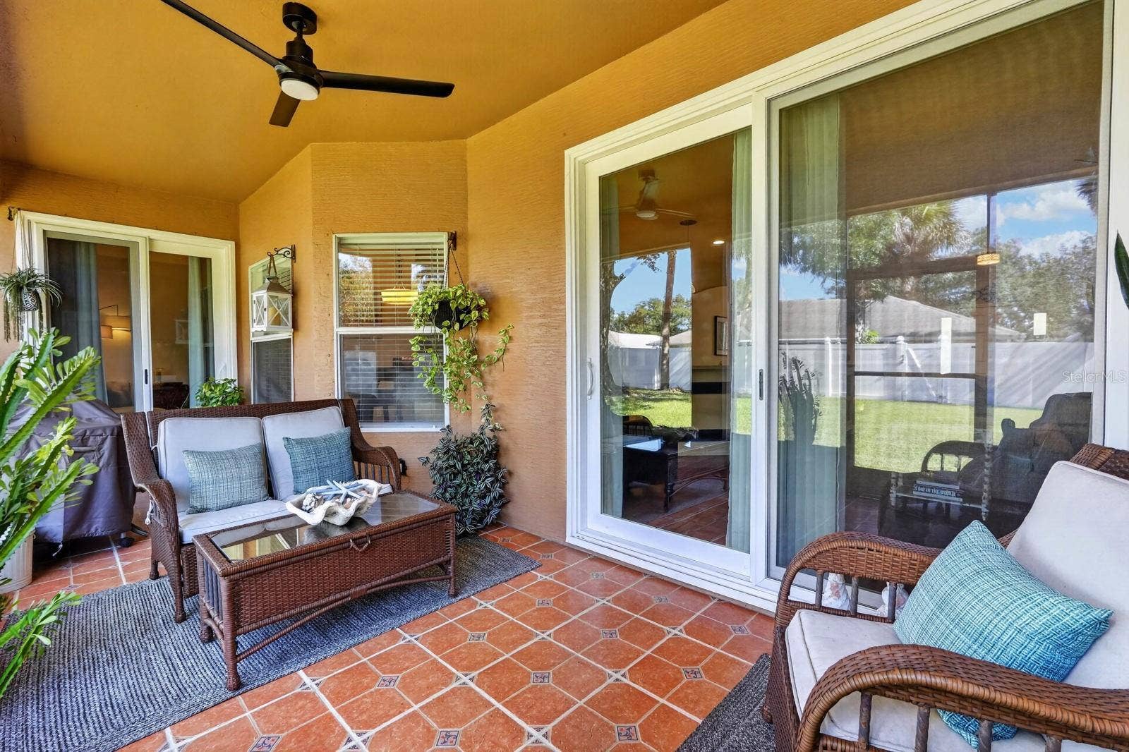 70 PICKERING DRIVE, Palm Coast, FL 32164 Covered, screened rear lanai with 3 points of access to the home