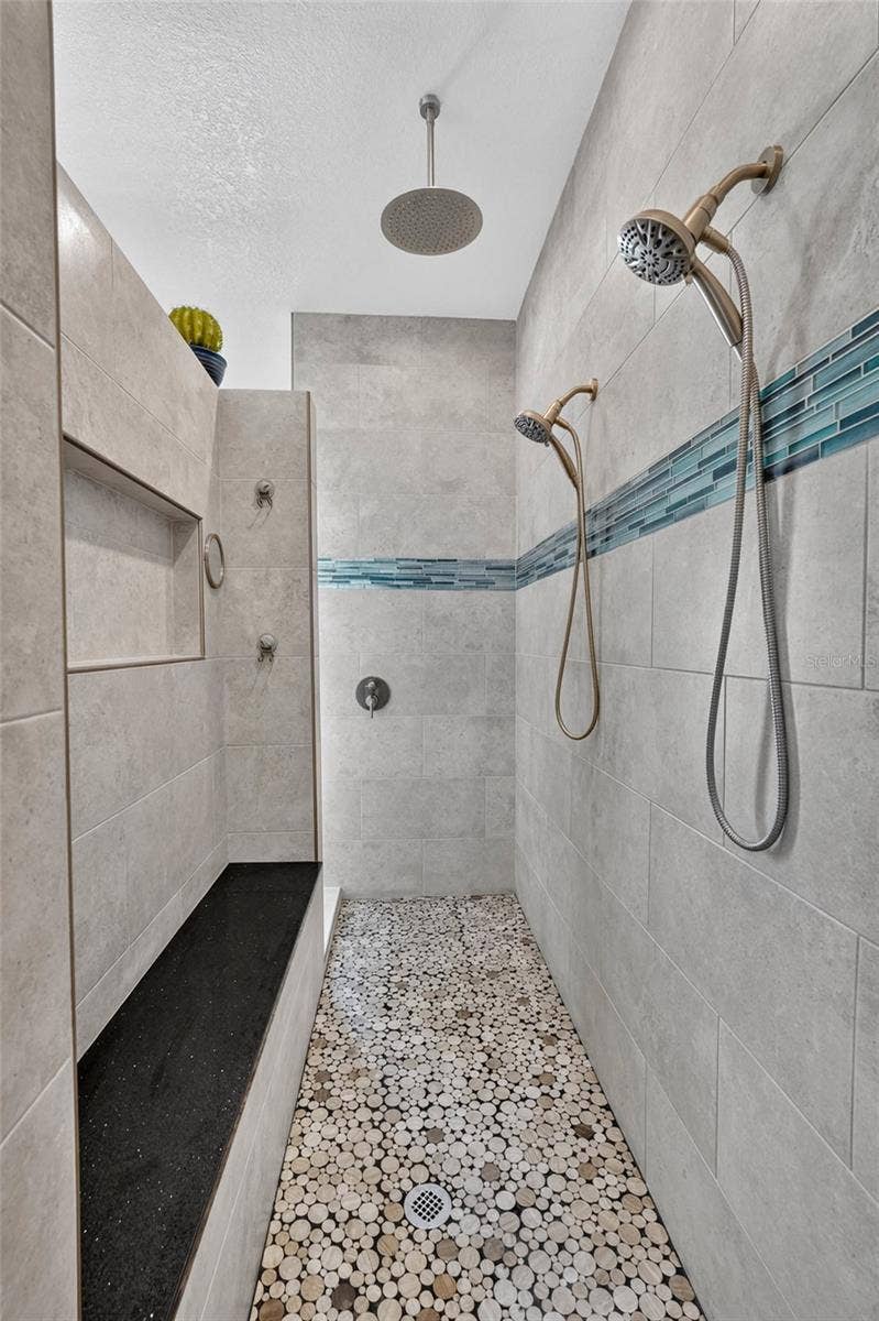 70 PICKERING DRIVE, Palm Coast, FL 32164 Built in bench seat and large shower niche