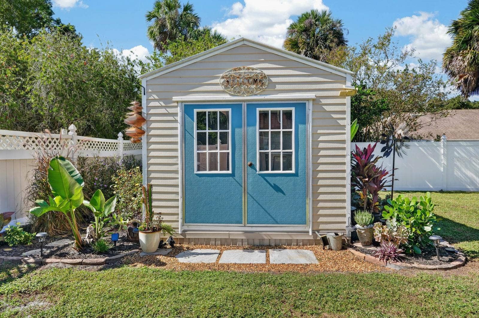70 PICKERING DRIVE, Palm Coast, FL 32164 Large 10' x 12' shed with beautiful landscape