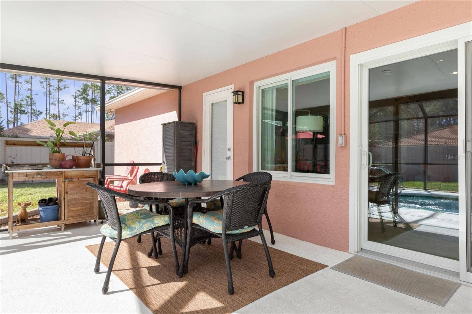The covered patio offers a shady escape from the Florida sun, with convenient access to the screened pool just steps away. Whether enjoying the outdoors or taking a refreshing dip, relaxation is always within reach!