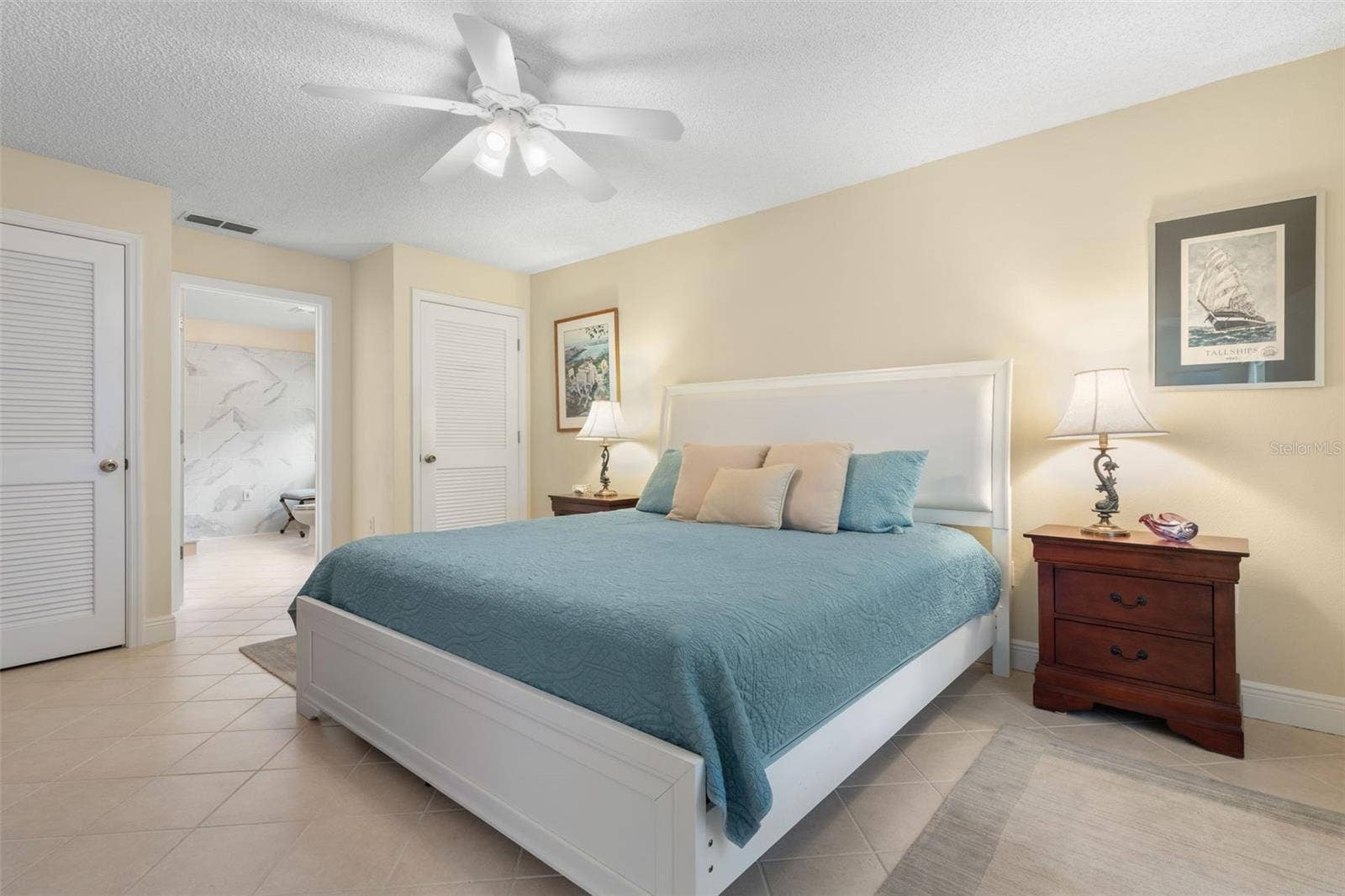 At the end of the day, retreat to your spacious primary suite, where soothing coastal tones and a peaceful atmosphere invite you to relax and recharge, with the added luxury of your own private ensuite bath.