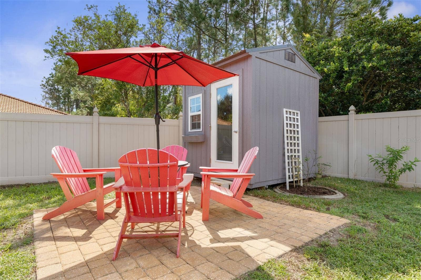 A little getaway right in your own backyard! The charming she shed offers endless possibilities for creativity or hobbies, while the separate paver patio is perfect for morning coffee, afternoon chats