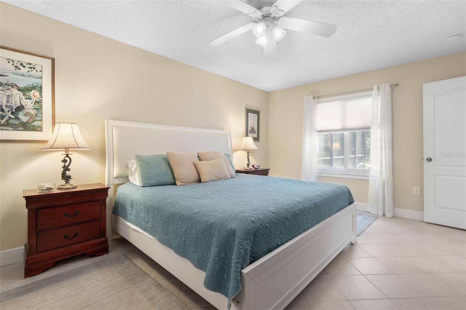 Imagine waking up to the Florida sunshine with a glimpse of your sparkling pool just beyond the window. This primary bedroom brings a little vacation feeling to every morning!