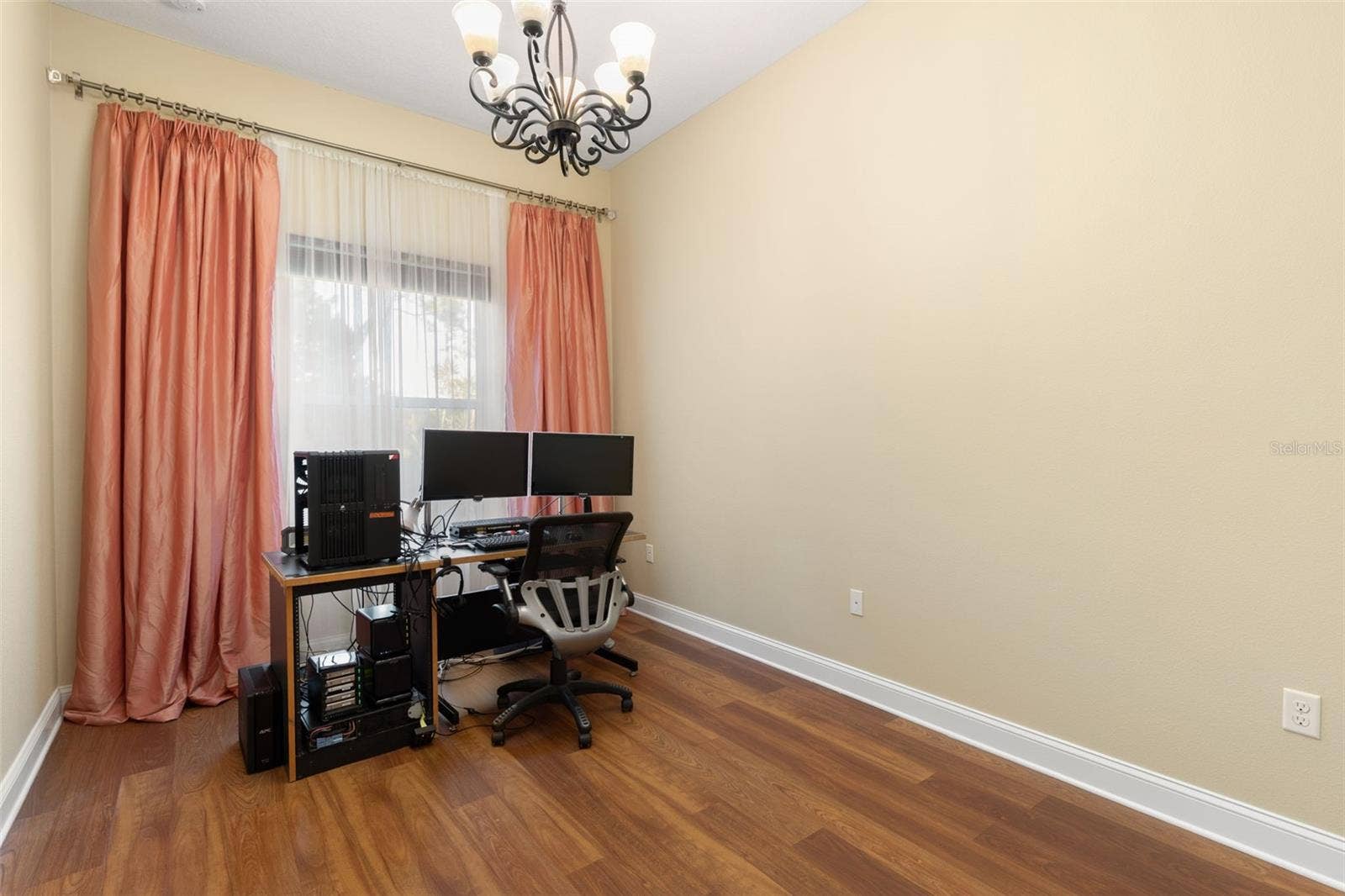 25 EMERALD LAKE COURT, Palm Coast, FL 32137 First-Floor Bedroom #3 is currently used as a home office, offering a versatile space that can easily accommodate a variety of needs.