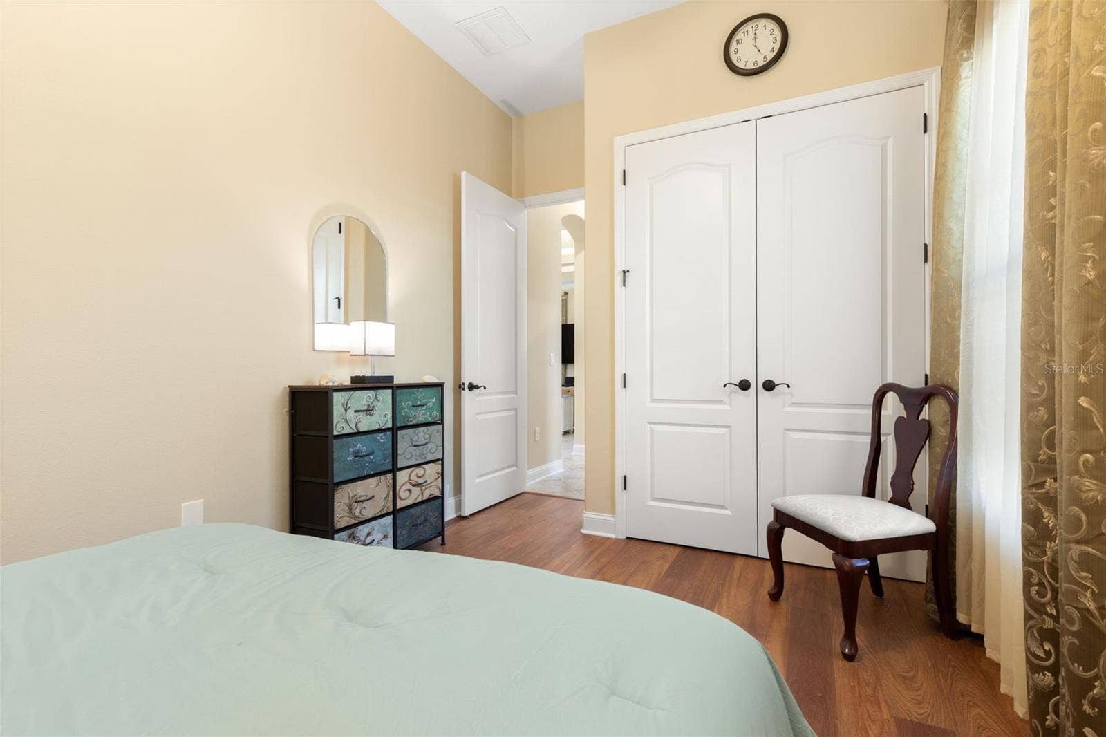 25 EMERALD LAKE COURT, Palm Coast, FL 32137 Another perspective of First-Floor Bedroom #2, highlighting its closet space and convenient location within the home.