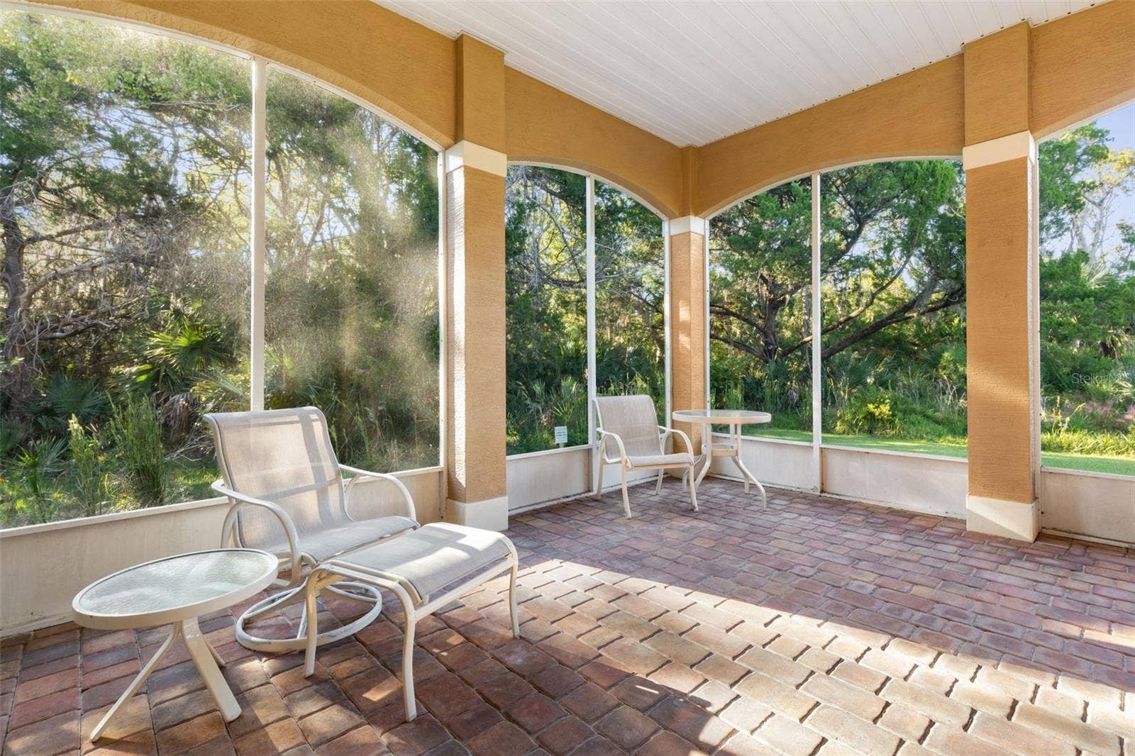 25 EMERALD LAKE COURT, Palm Coast, FL 32137 Relaxed indooroutdoor living on the spacious screened lanai with peaceful conservation views.