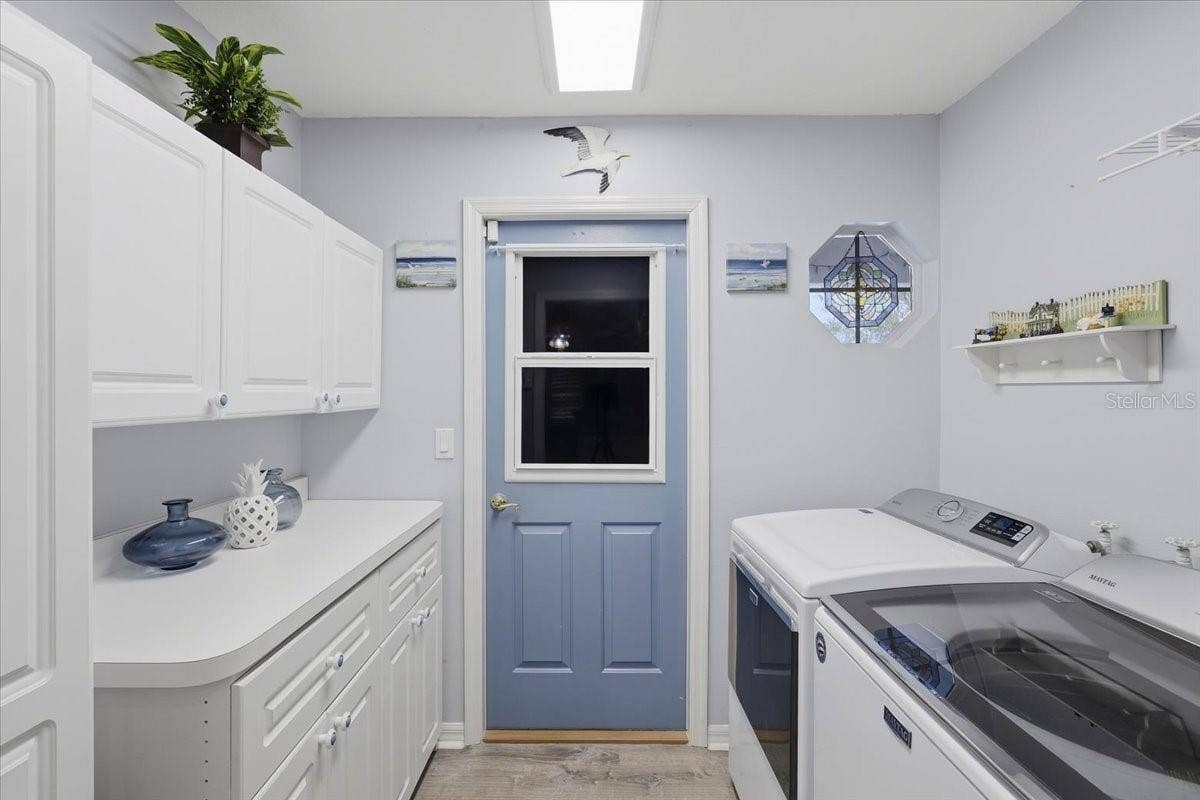 3 RYMM PLACE, Palm Coast, FL 32164 LAUNDRY ROOM WITH STORAGE