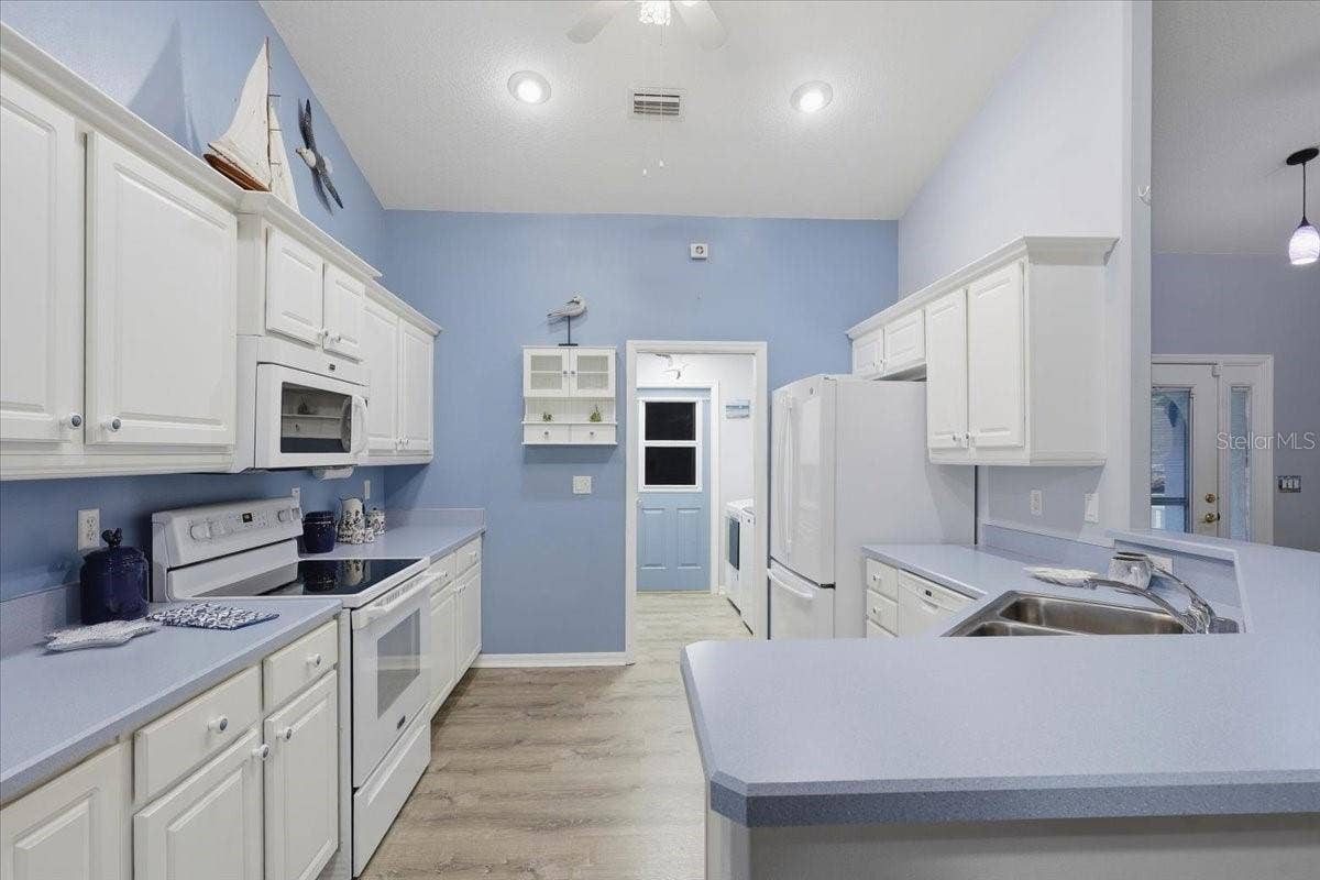 3 RYMM PLACE, Palm Coast, FL 32164 KITCHEN TO LAUNDRY ROOM