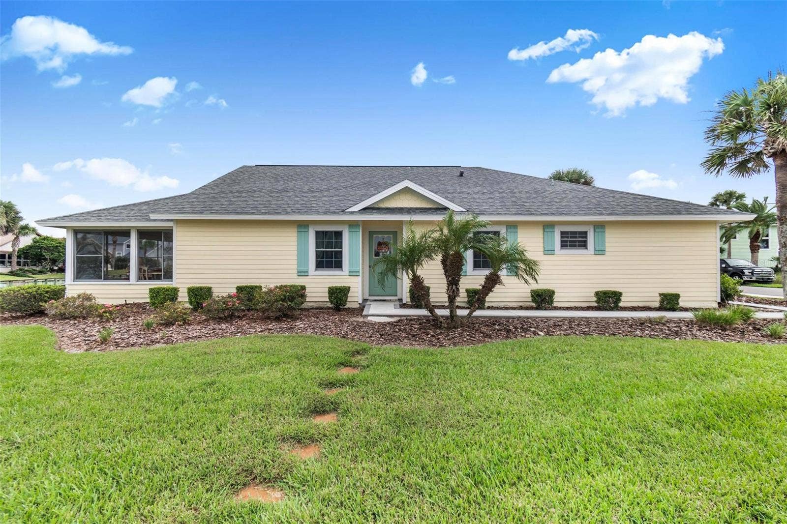 50 MEDFORD DRIVE, Palm Coast, FL 32137 Front of house facing lake and fountain