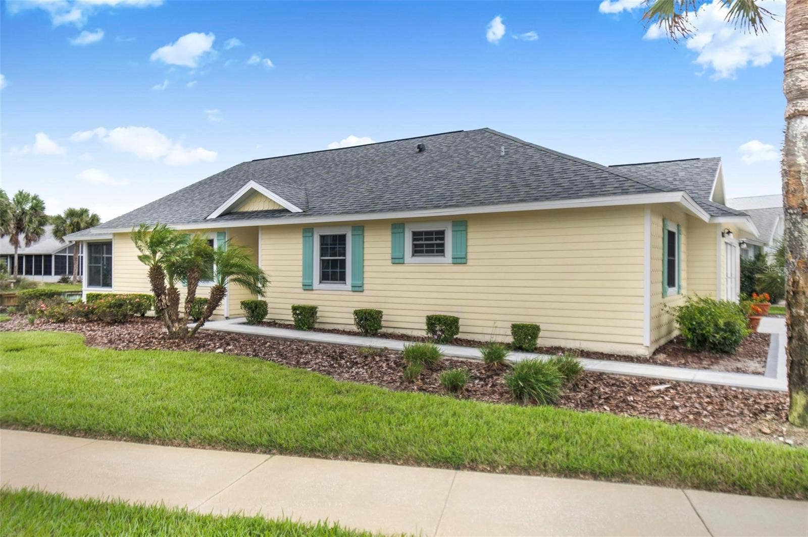50 MEDFORD DRIVE, Palm Coast, FL 32137 Front of house facing lake with fountain