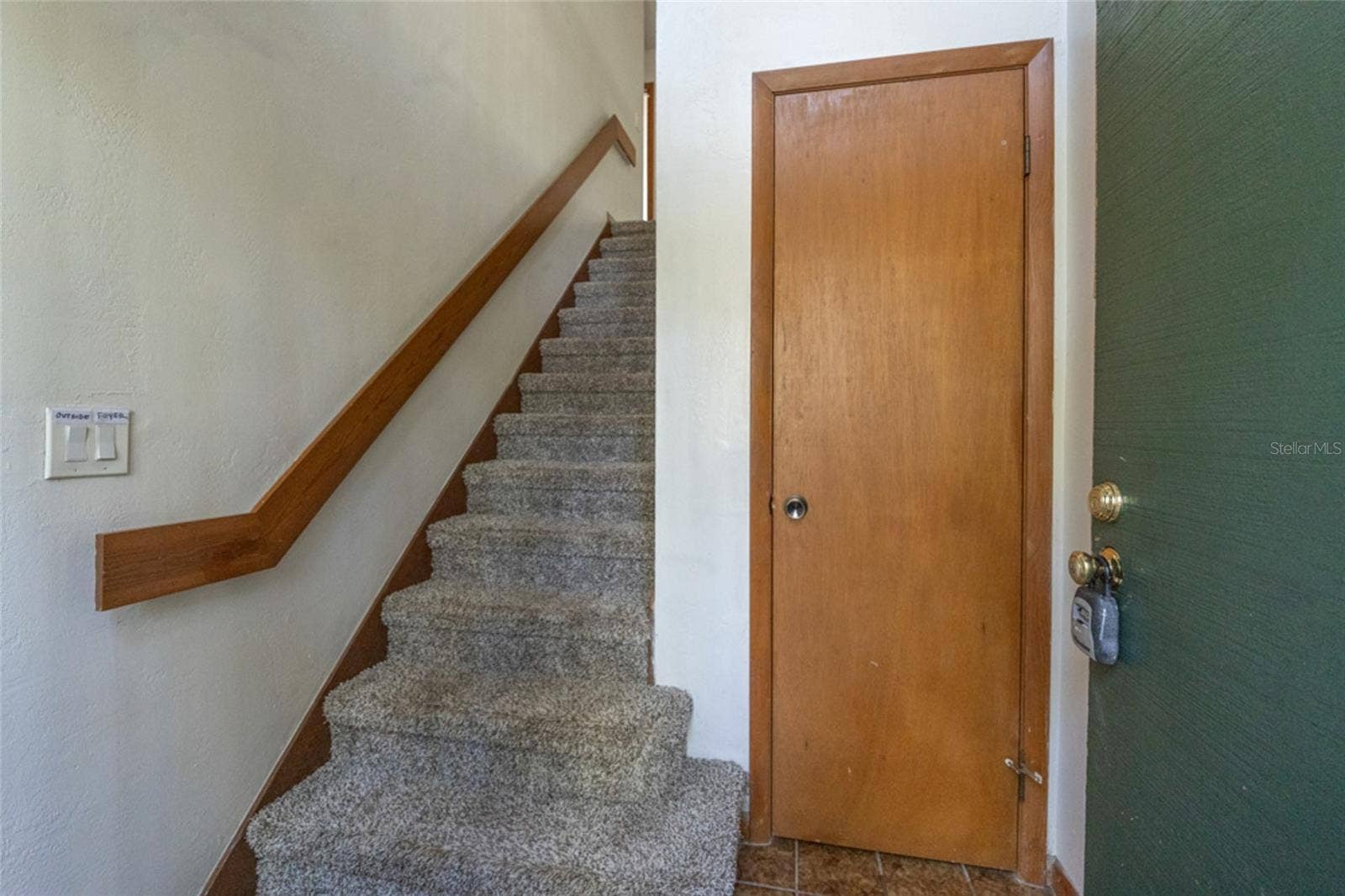Safe Entry On The First Floor Boasts Roomy Closet And Carpeted Stairs To Main Living Area