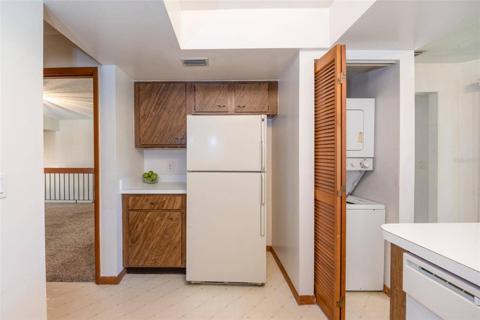 Laundry Closet In he Kitchen. Stackable Unit Conveys