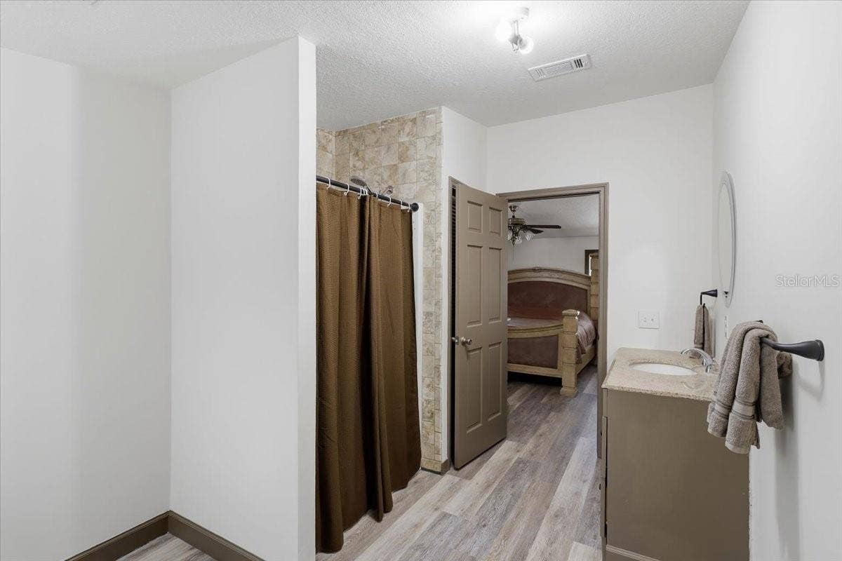9860 NIKOLICH AVENUE, Hastings, FL 32145 Primary bathroom/walk-in shower