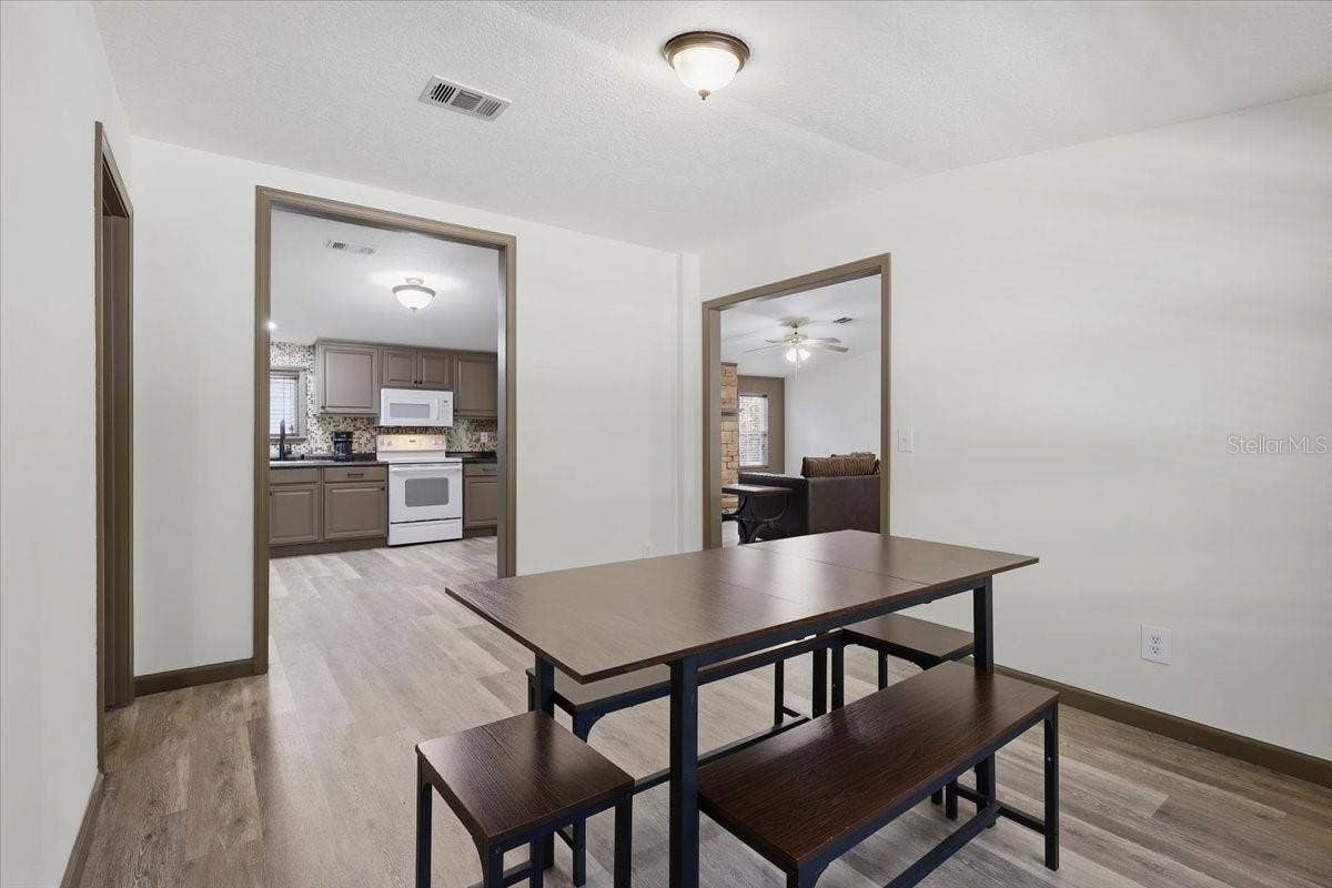 9860 NIKOLICH AVENUE, Hastings, FL 32145 Dining room off of kitchen area and living room