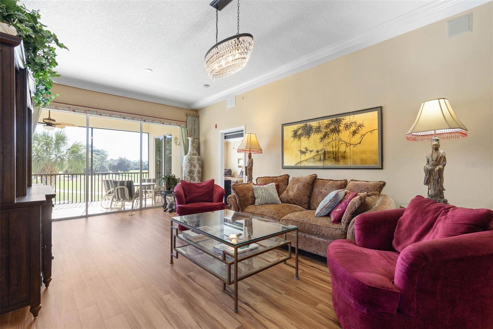 Light filled room with view of driving range and golf course