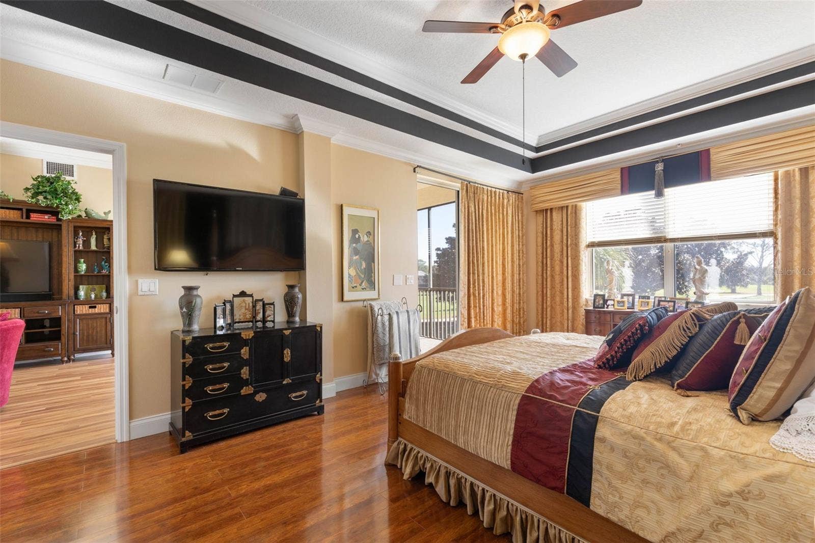 Primary bedroom with beautiful floors, slider to patio and plenty of sunshine!