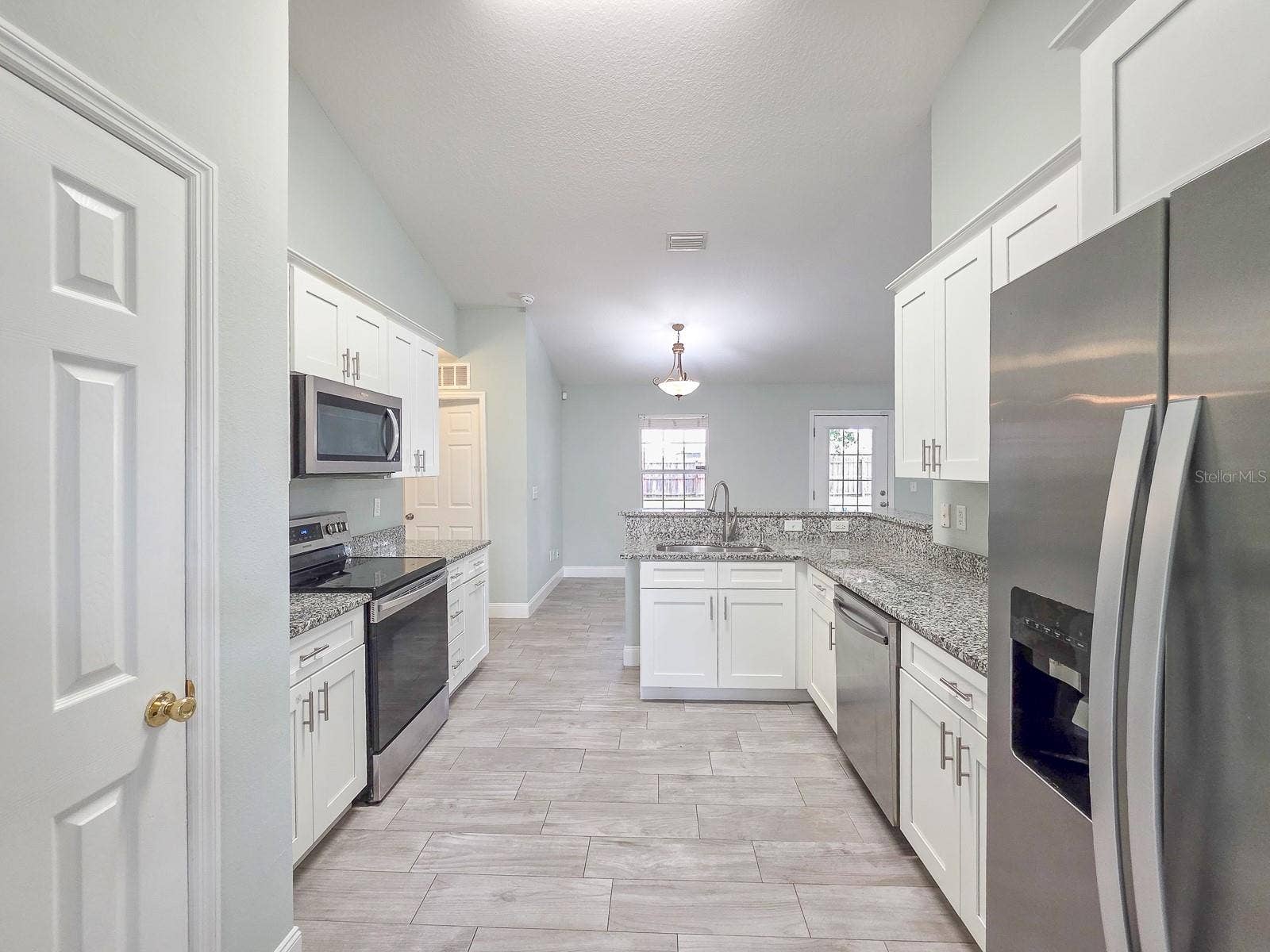 4 LLOWICK COURT, Palm Coast, FL 32164 Kitchen with granite tops and pantry