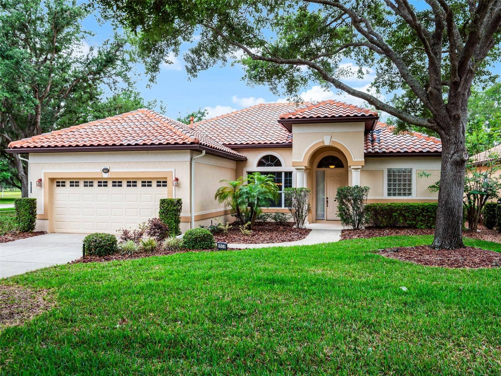9958 SANTA BARBARA COURT, Howey In The Hills, FL 34737 Stunning corner lot with Pond and Greenbelt view