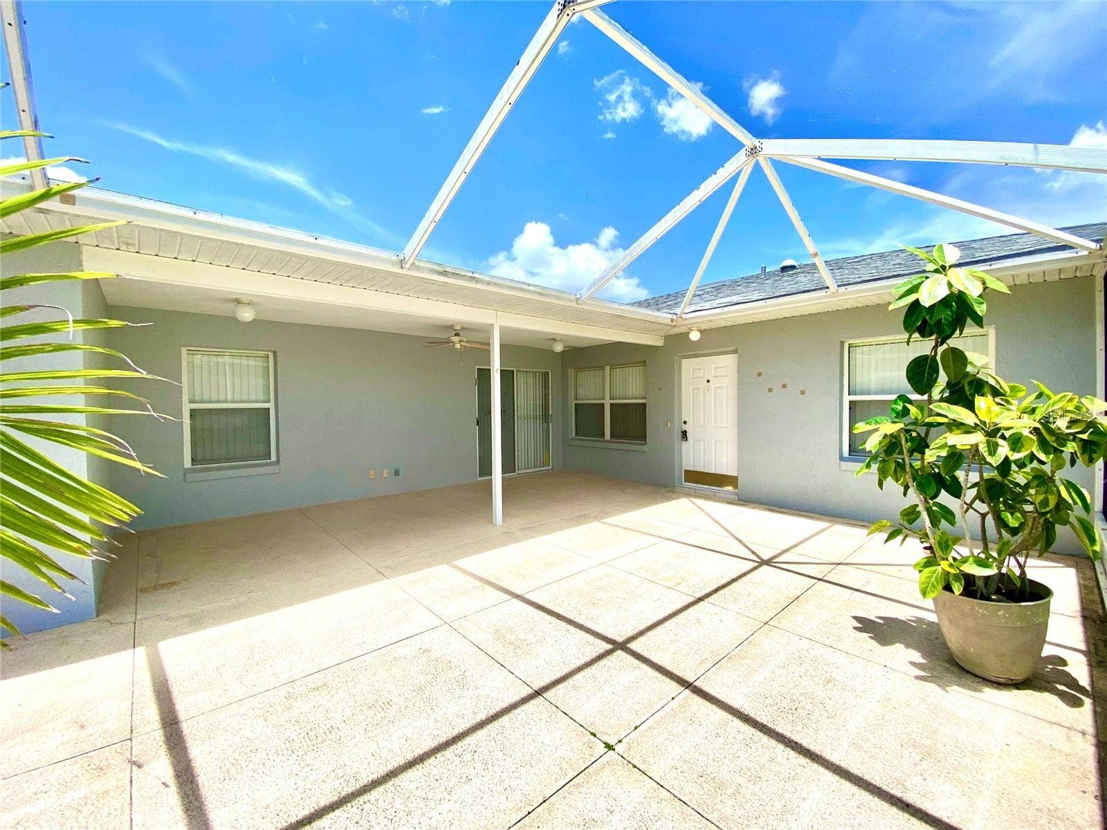 1129 APPLE TERRACE, Leesburg, FL 34748 Patio with screen doors to kitchen area. 1129 Apple Terrace