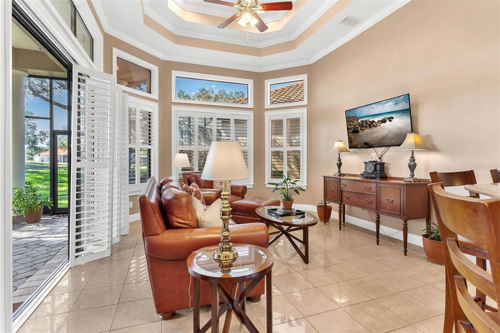 Family Room with custom plantation window treatments...
