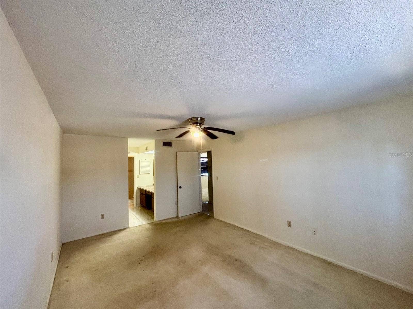 500 NEWELL HILL ROAD, #101A, Leesburg, FL 34748 Primary bedroom looking toward private bathroom