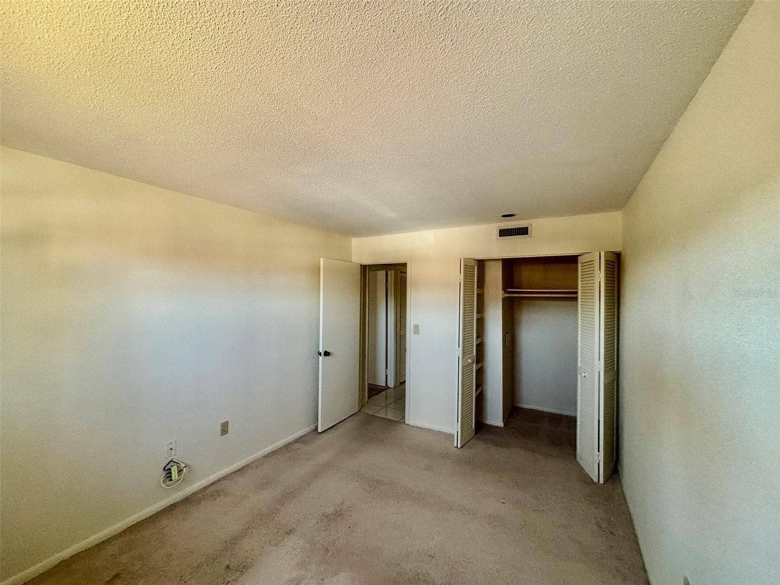 500 NEWELL HILL ROAD, #101A, Leesburg, FL 34748 Guest bedroom with walk-in closet