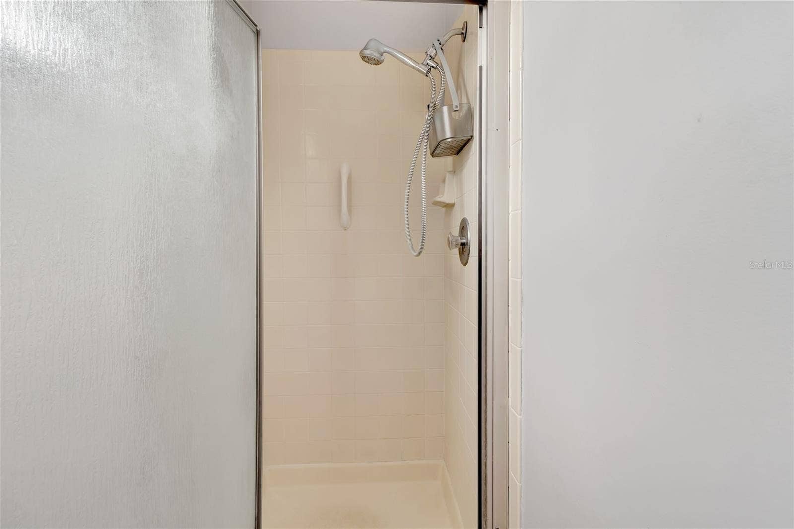 27 GORDON COURT, Leesburg, FL 34788 Step in shower in the Primary bedroom