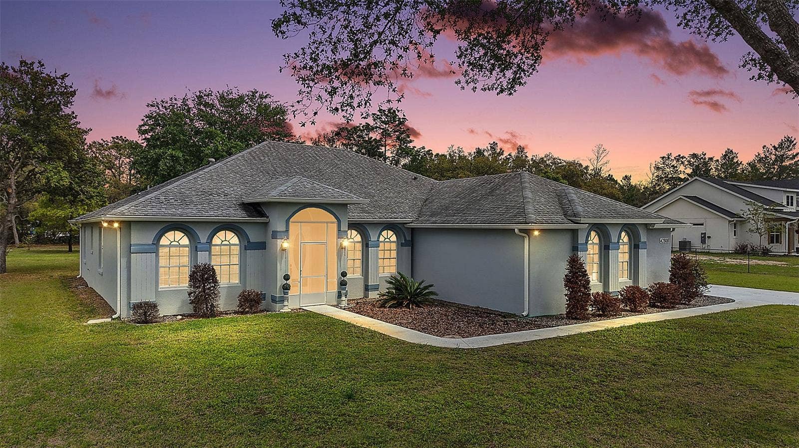 42808 ROYAL TRAILS ROAD, Eustis, FL 32736 Twilight Front Elevation