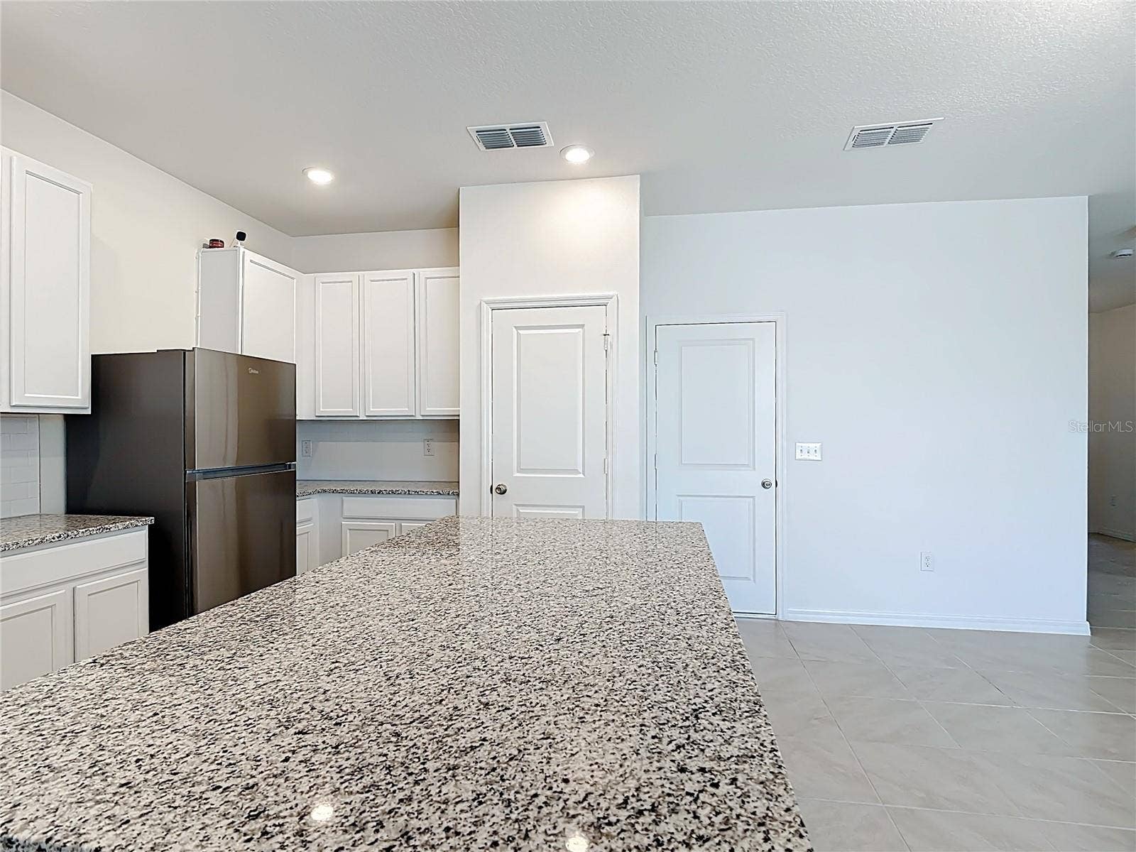 795 OVERPOOL AVENUE, Davenport, FL 33896 Stone kitchen countertops & pantry area
