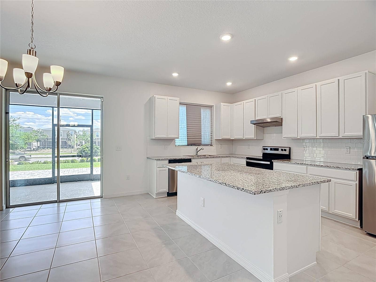 795 OVERPOOL AVENUE, Davenport, FL 33896 Dining room and Kitchen are