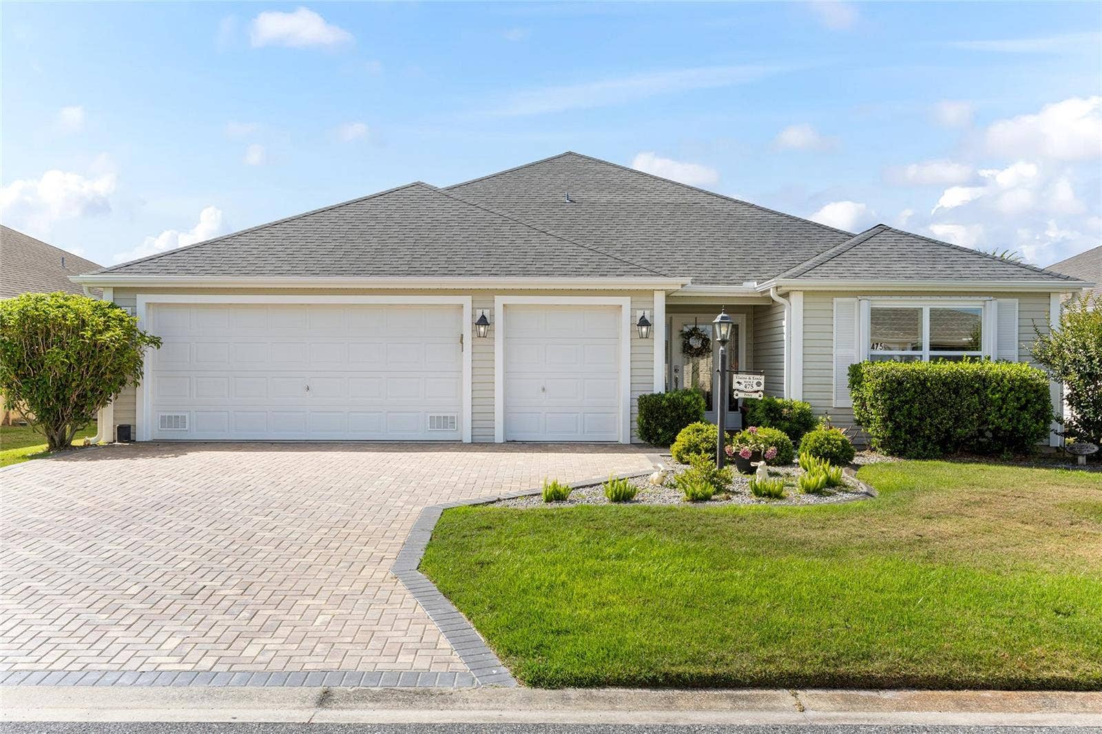 475 ISLAND HOUSE PATH, The Villages, FL 32163 Welcoming entry with paver enhanced driveway.