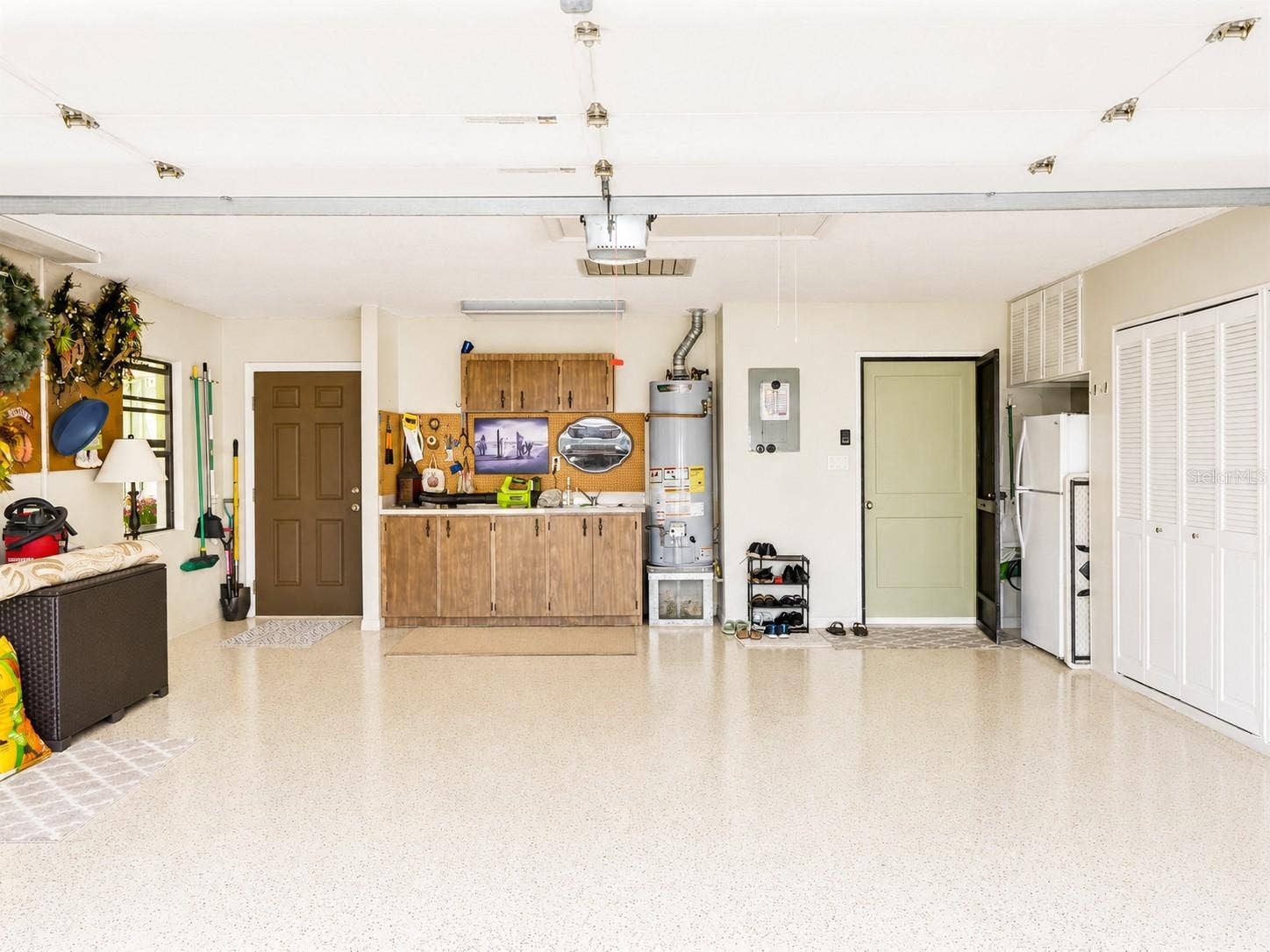 100 S TREMAIN STREET, #G2, Mount Dora, FL 32757 Two Car Garage: Epoxy Floor Coating, Work Bench & Utility Sink