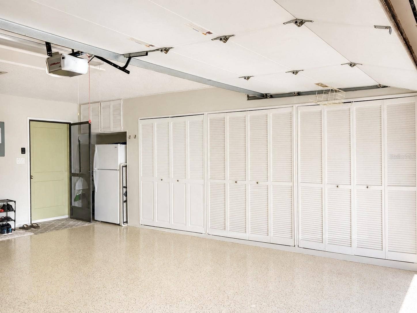 100 S TREMAIN STREET, #G2, Mount Dora, FL 32757 Garage: Wall-to-Wall Storage & Kitchen Entry