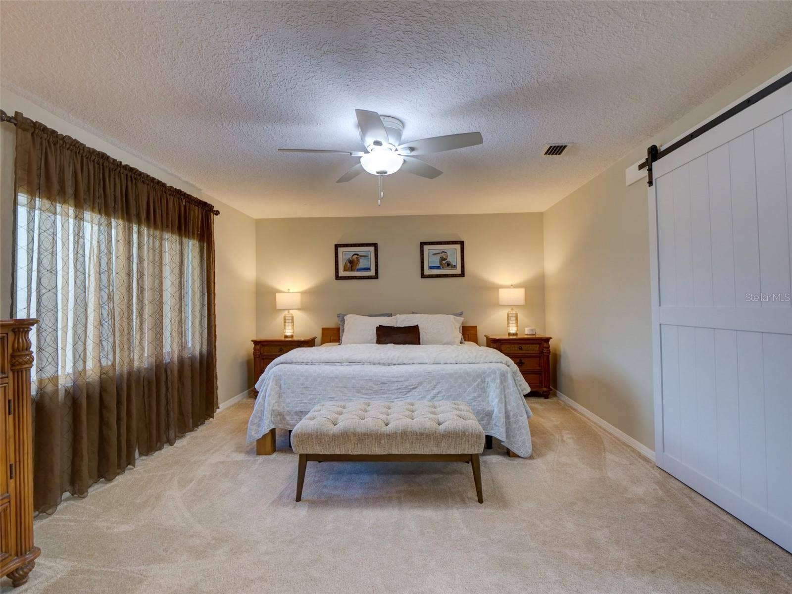 100 S TREMAIN STREET, #G2, Mount Dora, FL 32757 Primary Bedroom: Barn Door Closed