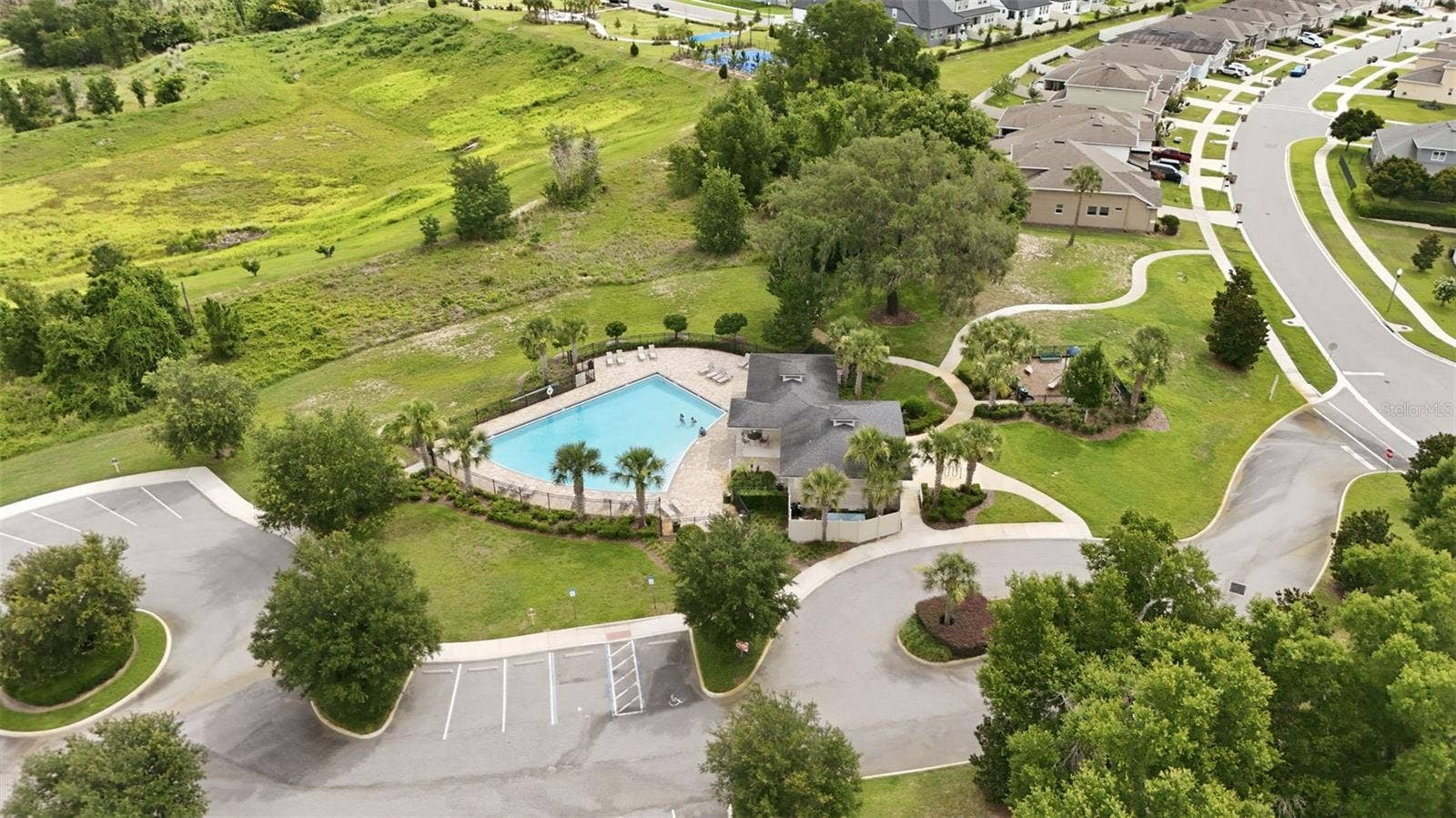 16716 ABBEY HILL COURT, Clermont, FL 34711 Community pool and playground