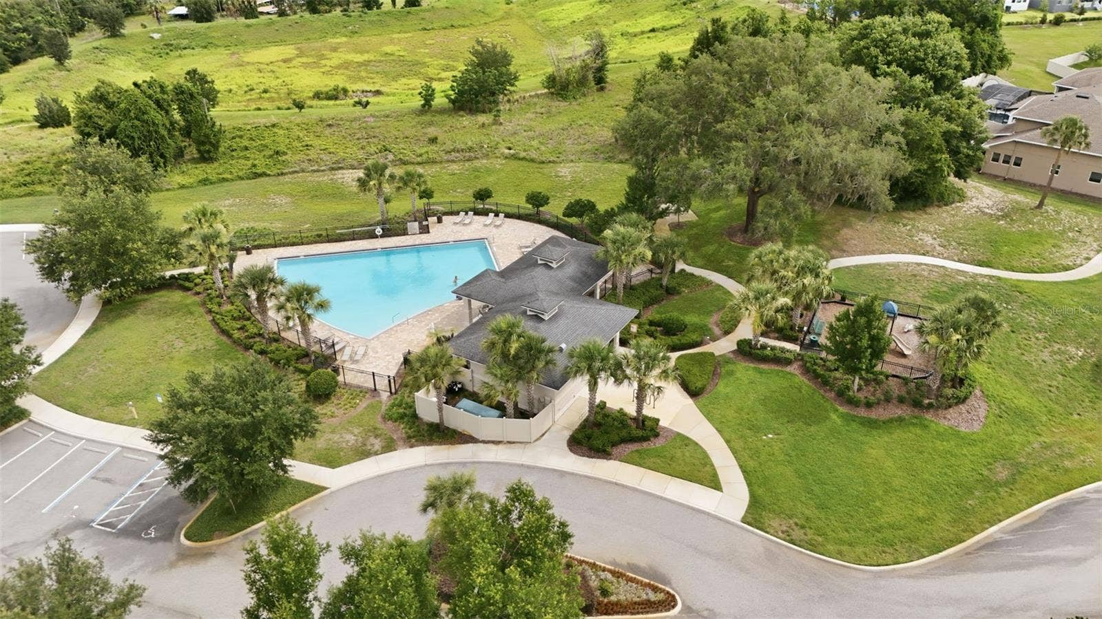 16716 ABBEY HILL COURT, Clermont, FL 34711 Community pool and playground at John's Lake Landing