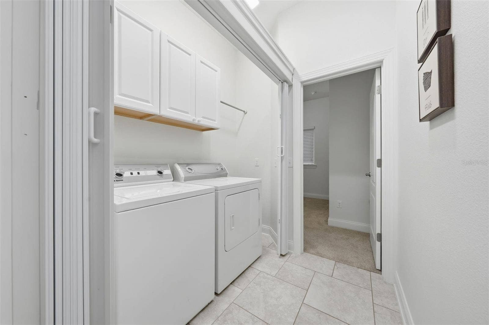 16716 ABBEY HILL COURT, Clermont, FL 34711 Laundry area leading into Guest Suite