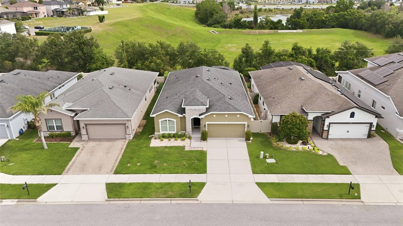 16716 ABBEY HILL COURT, Clermont, FL 34711 Aerial front view of home