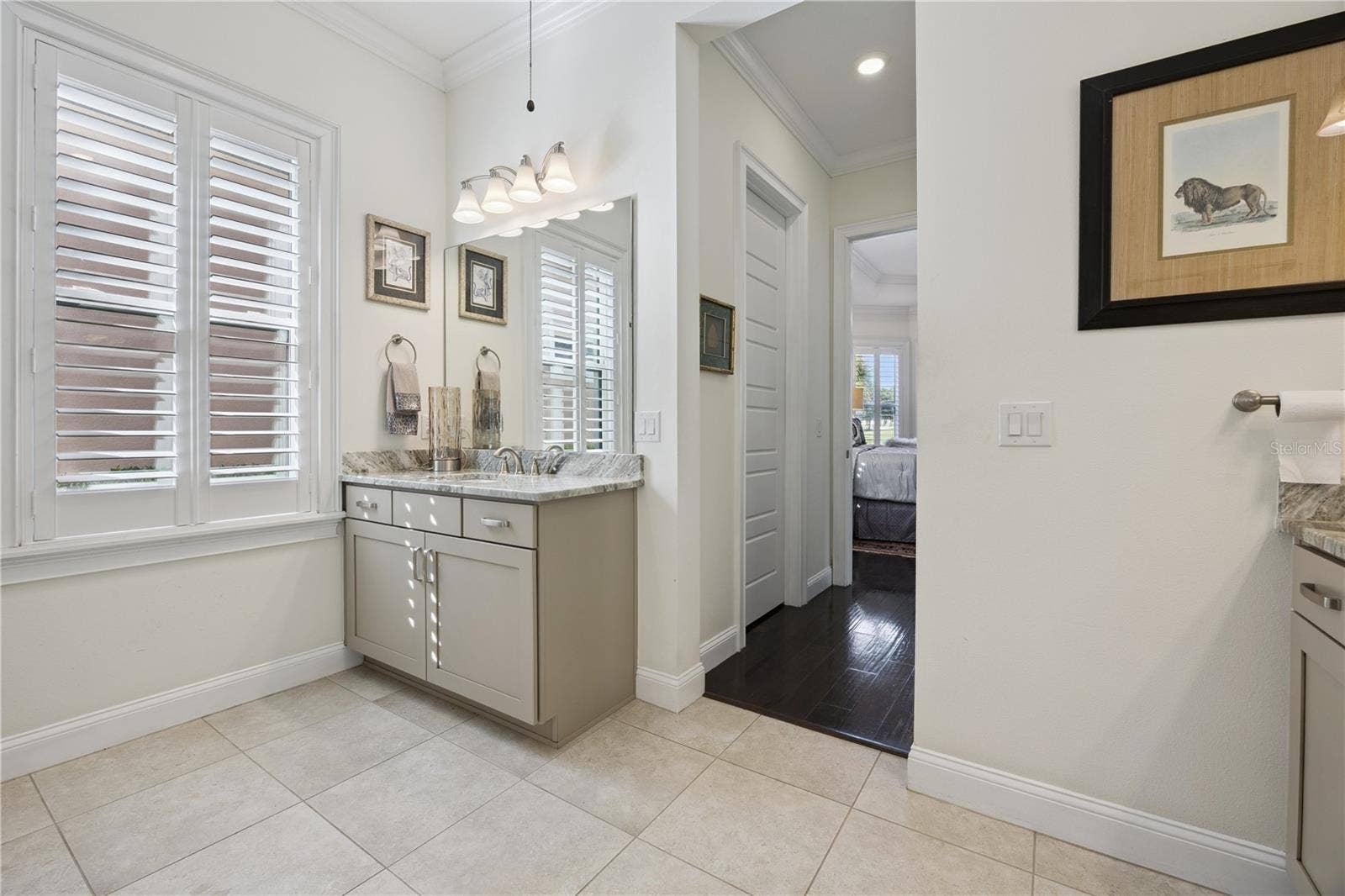 9219 SAN JOSE BOULEVARD, Howey In The Hills, FL 34737 Master bath with plantation shutters.