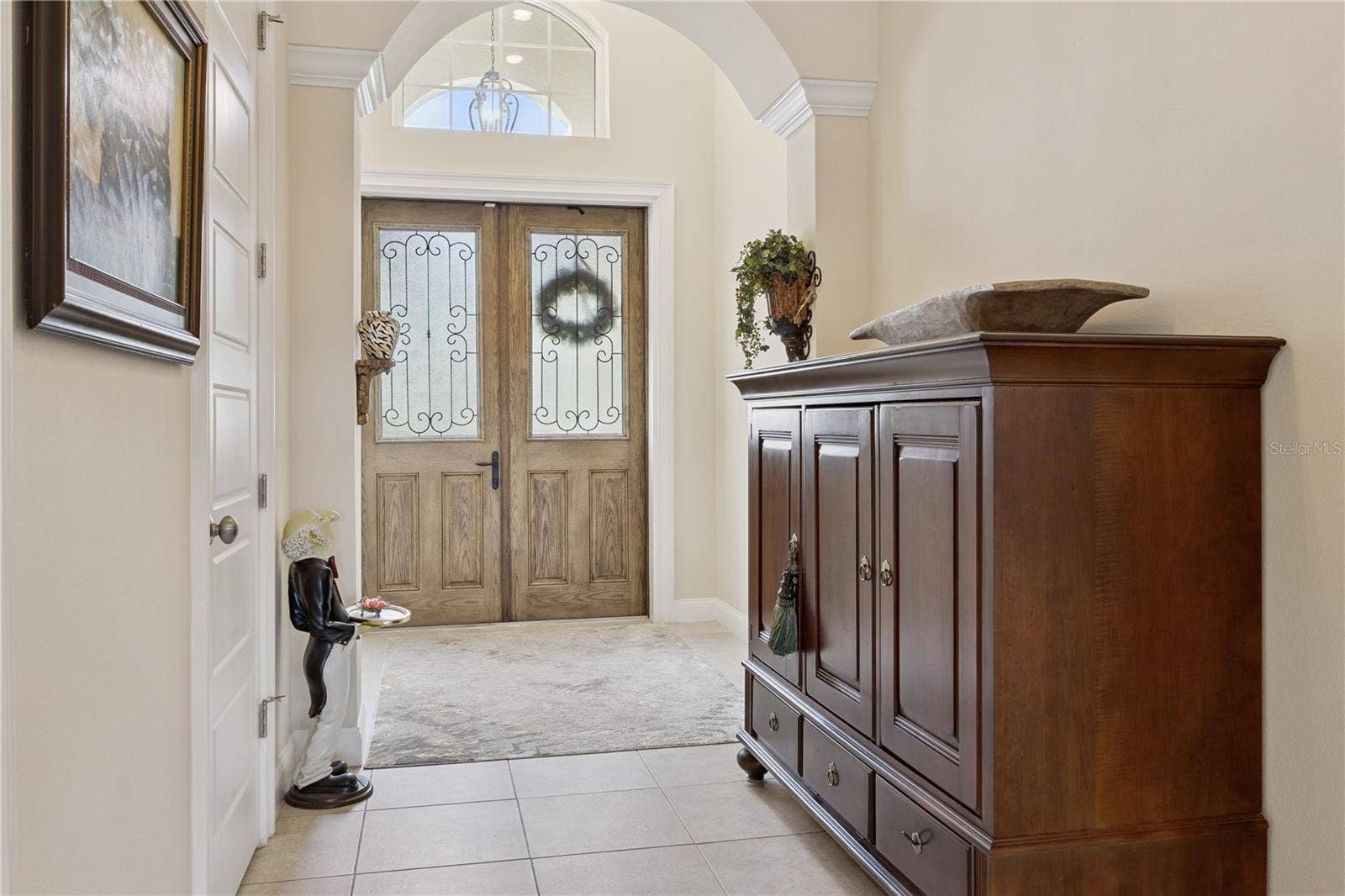 9219 SAN JOSE BOULEVARD, Howey In The Hills, FL 34737 Foyer with arch over wide entry way