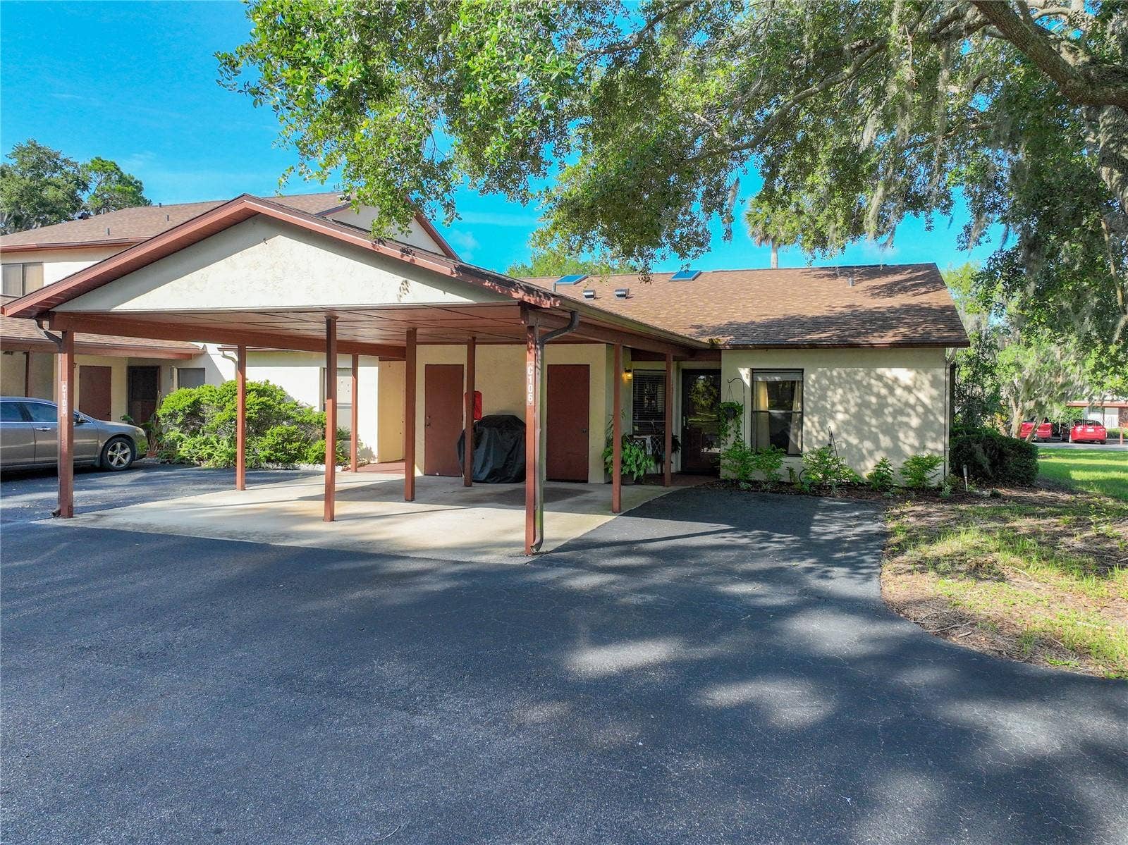 4300 BAYWOOD BOULEVARD, #C106, Mount Dora, FL 32757 Front View/Carport