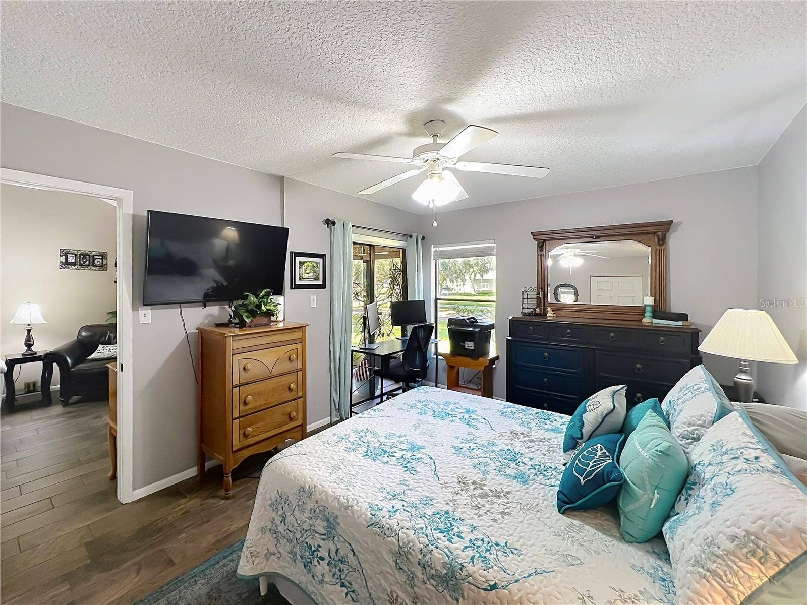 4300 BAYWOOD BOULEVARD, #C106, Mount Dora, FL 32757 Primary Bedroom with Sliding Glass Doors to Screened-In Patio