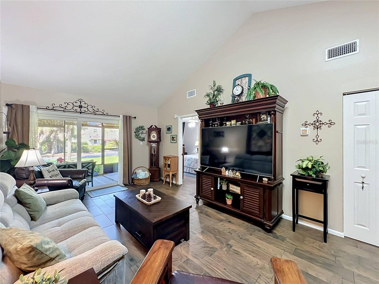 4300 BAYWOOD BOULEVARD, #C106, Mount Dora, FL 32757 Living Room with Sliding Glass Doors to Screened-In Patio
