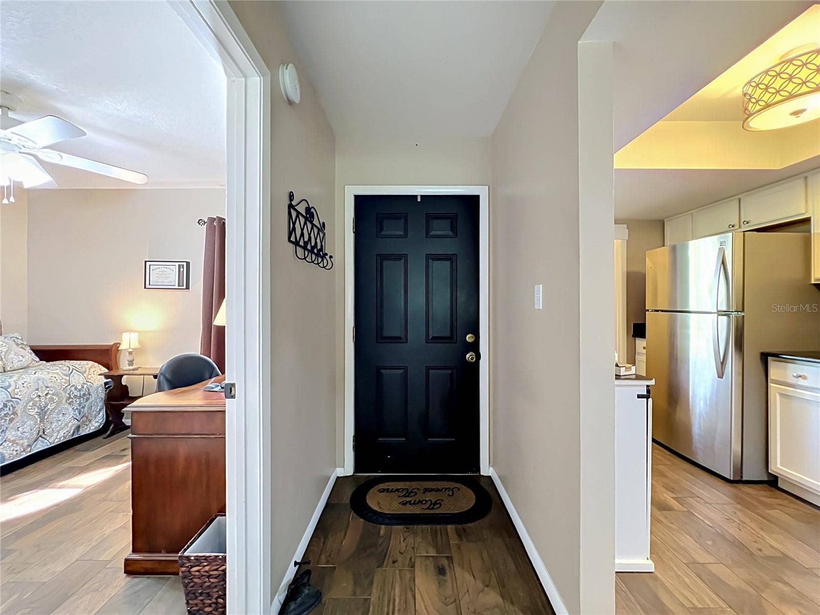 4300 BAYWOOD BOULEVARD, #C106, Mount Dora, FL 32757 Front Entry / Guest Bedroom and Kitchen