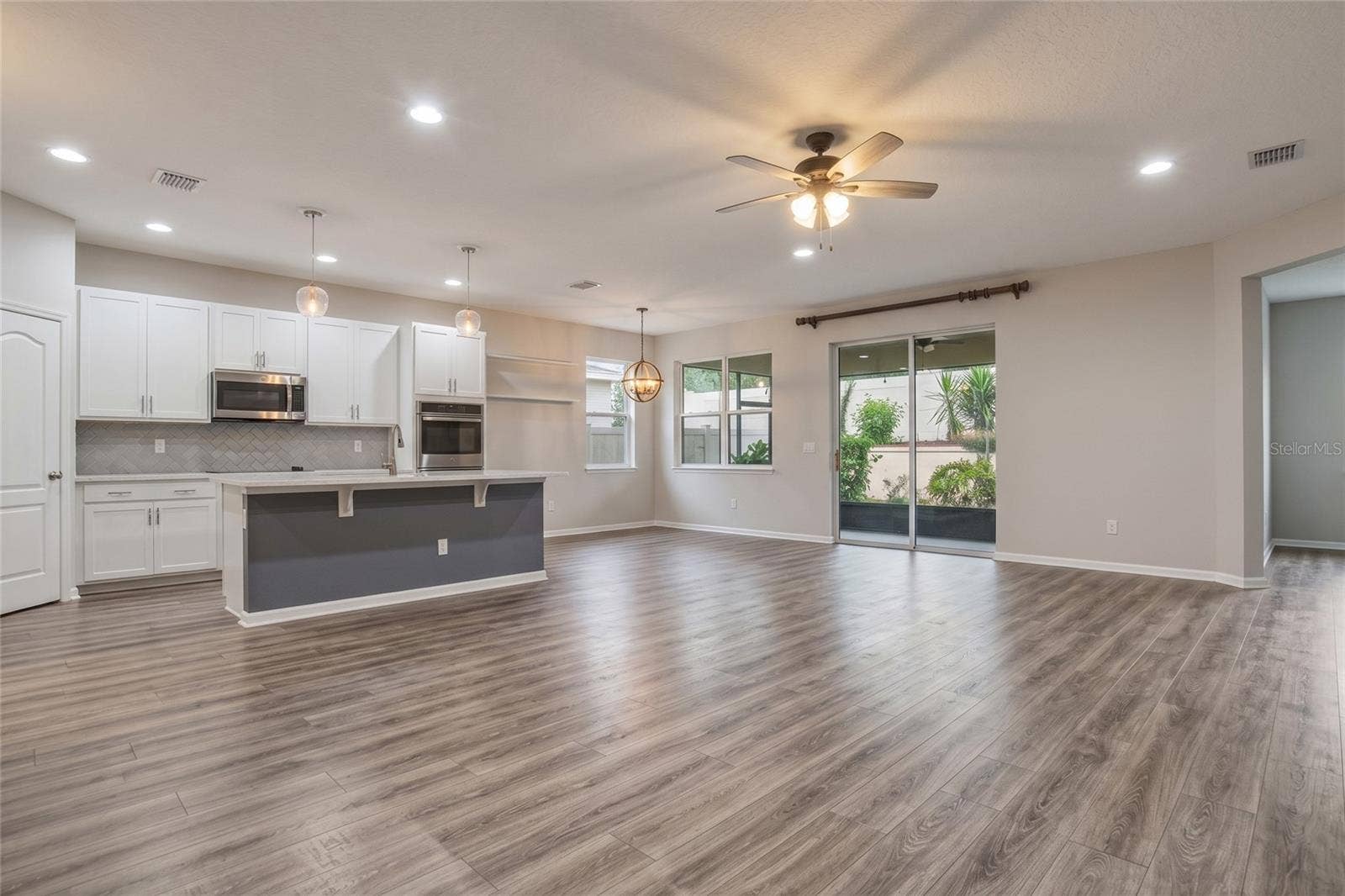 16742 ABBEY HILL COURT, Clermont, FL 34711 Living Room & Kitchen Empty