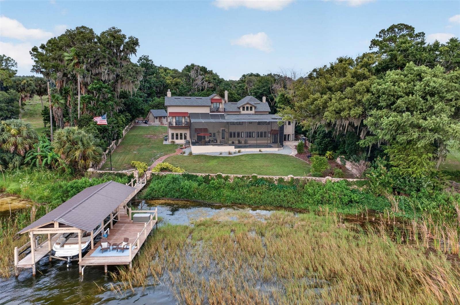 6118 DORA DR, Mount Dora, FL 32757 On the shores of Lake Beauclaire.